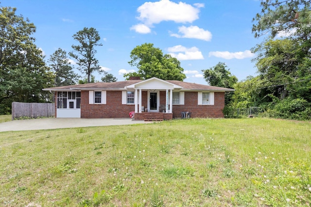 102 Briarcliff St, Belvedere, SC 29841 - ranch-style house with brick siding, a sunroom, and concrete driveway