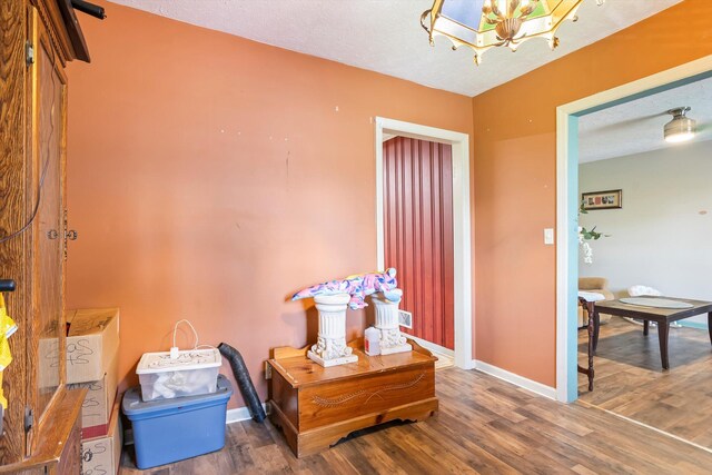 102 Briarcliff St, Belvedere, SC 29841 - hallway with wood finished floors and a chandelier