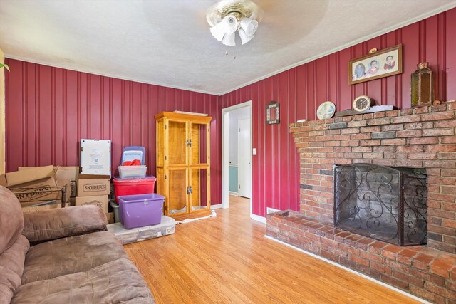102 Briarcliff St, Belvedere, SC 29841 - living area featuring a fireplace, a ceiling fan, wood finished floors, and crown molding
