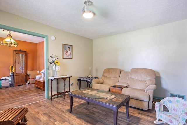 102 Briarcliff St, Belvedere, SC 29841 - living room featuring wood finished floors and a textured ceiling