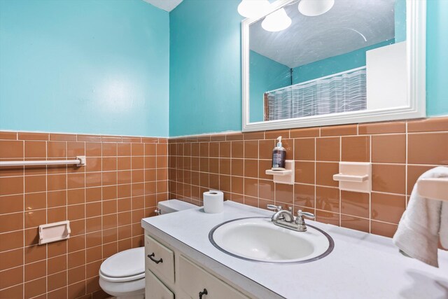 102 Briarcliff St, Belvedere, SC 29841 - bathroom with tile walls, vanity, a shower with shower curtain, and wainscoting