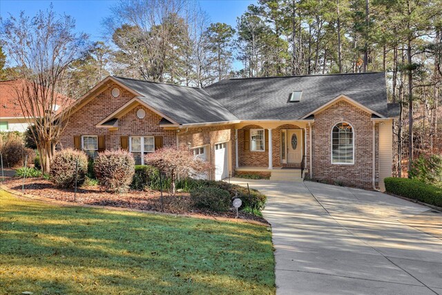 ranch-style home with a front lawn