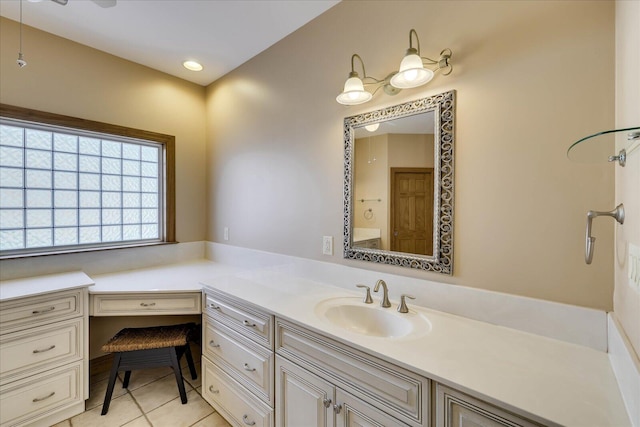 bathroom featuring tile patterned flooring and vanity