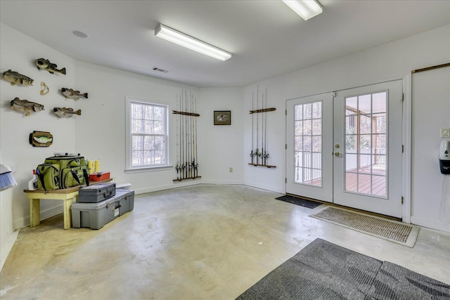 entryway with french doors, visible vents, concrete flooring, and baseboards