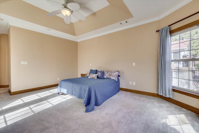 carpeted bedroom featuring visible vents, multiple windows, baseboards, and ornamental molding