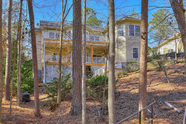 rear view of house with a balcony