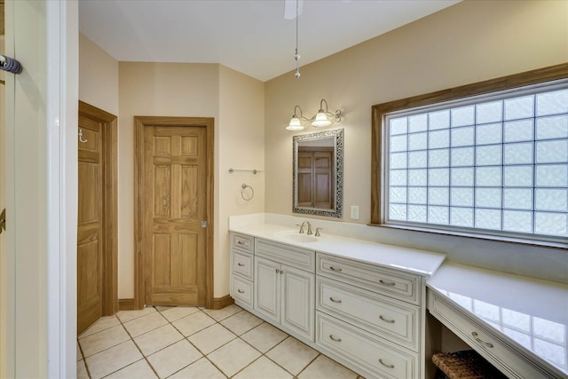 bathroom featuring tile patterned flooring and vanity