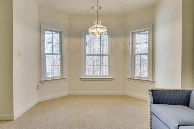 unfurnished room with a chandelier, visible vents, baseboards, and carpet floors