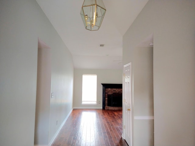 526 Timberchase Ln, Aiken, SC 29803 - hall featuring wood-type flooring, vaulted ceiling, baseboards, and a chandelier