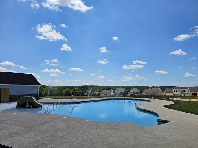 view of pool featuring a patio area