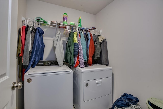 washroom featuring washer and dryer