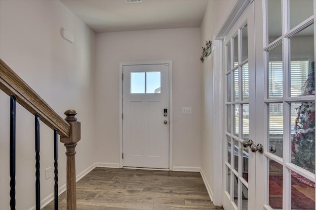 entrance foyer featuring hardwood / wood-style floors and french doors