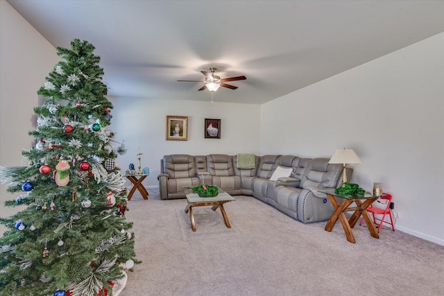 carpeted living room featuring ceiling fan