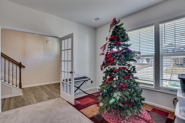 entrance foyer with french doors and carpet