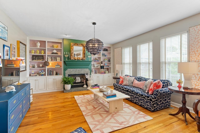 3637 Foxfire Pl, Martinez, GA 30907 - living room with plenty of natural light, light wood finished floors, a fireplace with raised hearth, and built in shelves