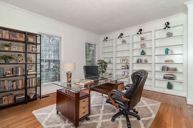 unfurnished living room featuring light wood finished floors, crown molding, stairs, and a notable chandelier