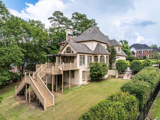 3997 Hammonds Fry, Evans, GA 30809 - back of property featuring stairway, stucco siding, a wooden deck, a yard, and a chimney