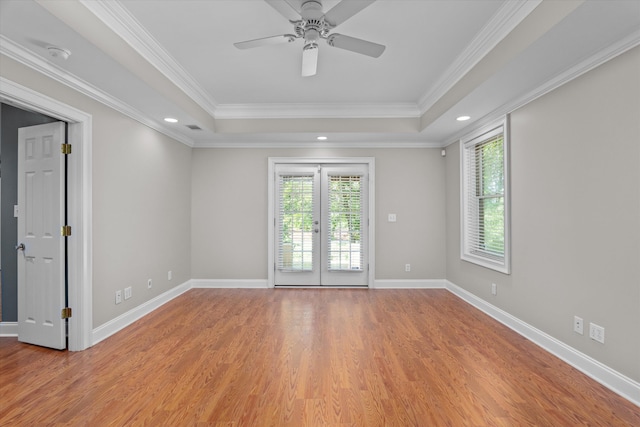 3997 Hammonds Fry, Evans, GA 30809 - unfurnished room featuring a tray ceiling, healthy amount of natural light, french doors, light wood-type flooring, and ornamental molding