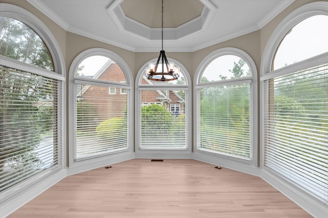 3997 Hammonds Fry, Evans, GA 30809 - unfurnished sunroom with plenty of natural light, wood finished floors, a chandelier, and ornamental molding