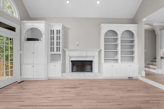 3997 Hammonds Fry, Evans, GA 30809 - unfurnished living room featuring light wood-style floors, vaulted ceiling, a fireplace, recessed lighting, and stairway