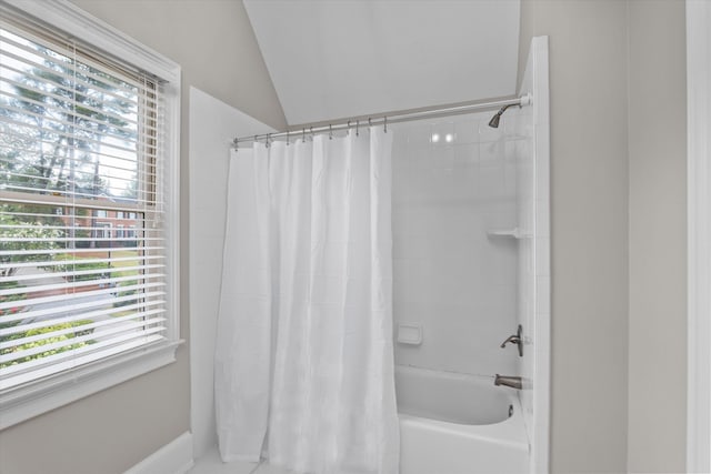 3997 Hammonds Fry, Evans, GA 30809 - full bathroom featuring healthy amount of natural light, shower / bath combo with shower curtain, and lofted ceiling