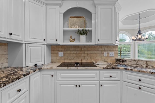 3997 Hammonds Fry, Evans, GA 30809 - kitchen with black electric stovetop, white cabinets, and a chandelier
