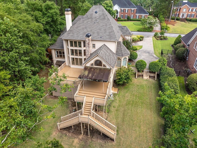 3997 Hammonds Fry, Evans, GA 30809 - rear view of house with stairs, a chimney, a shingled roof, and stucco siding