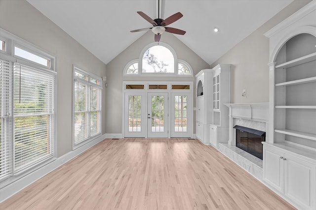 3997 Hammonds Fry, Evans, GA 30809 - unfurnished living room with a ceiling fan, light wood-style flooring, a fireplace, french doors, and built in features