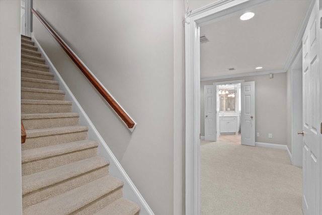 3997 Hammonds Fry, Evans, GA 30809 - stairs featuring crown molding, carpet floors, recessed lighting, and a chandelier