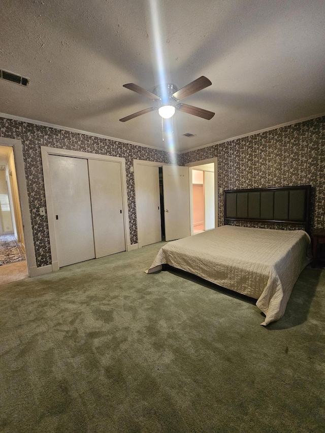 unfurnished bedroom with wallpapered walls, ornamental molding, and a textured ceiling