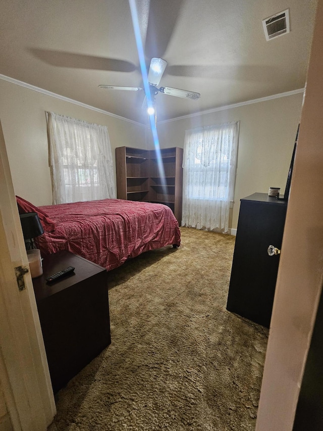 bedroom featuring carpet, visible vents, ceiling fan, and crown molding