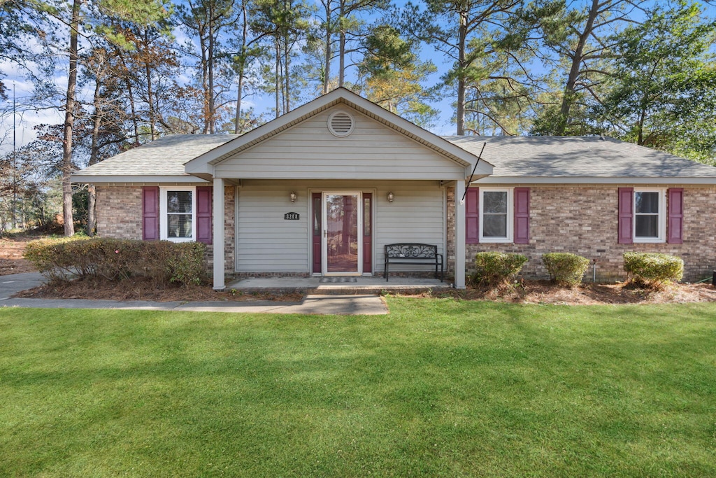 ranch-style house with a front yard