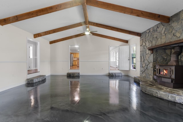5131 Deans Bridge Rd, Blythe, GA 30805 - unfurnished living room featuring a wood stove, baseboards, concrete flooring, and a ceiling fan