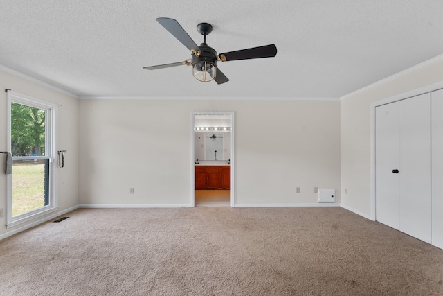 5131 Deans Bridge Rd, Blythe, GA 30805 - unfurnished bedroom featuring ornamental molding, carpet flooring, a textured ceiling, baseboards, and ensuite bath
