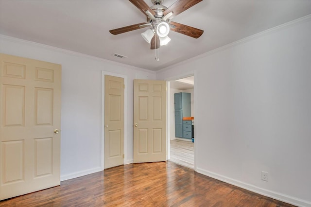 unfurnished bedroom with ceiling fan, crown molding, and wood-type flooring