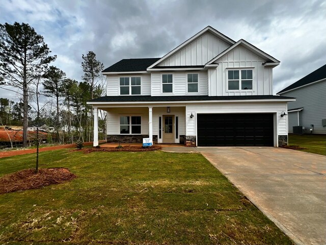 view of front facade with a porch and a garage