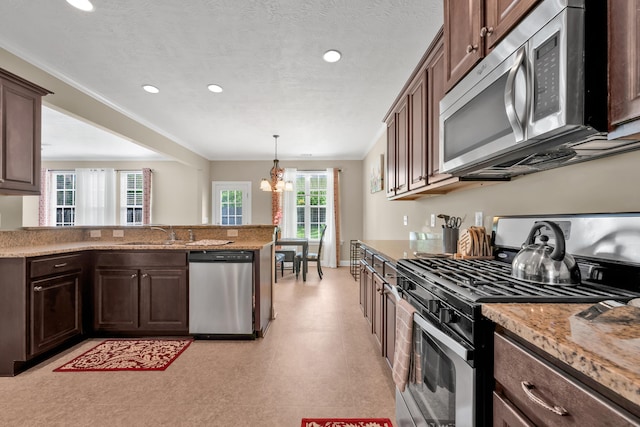 532 Bunchgrass St, Evans, GA 30809 - kitchen featuring appliances with stainless steel finishes, light floors, a chandelier, recessed lighting, and dark brown cabinetry