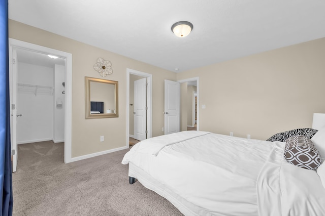 532 Bunchgrass St, Evans, GA 30809 - carpeted bedroom featuring a walk in closet, baseboards, and a closet