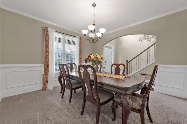 532 Bunchgrass St, Evans, GA 30809 - dining room featuring ornamental molding, carpet floors, arched walkways, a chandelier, and wainscoting