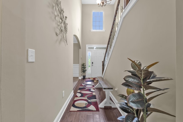 532 Bunchgrass St, Evans, GA 30809 - entrance foyer featuring arched walkways, a high ceiling, stairs, wood finished floors, and baseboards