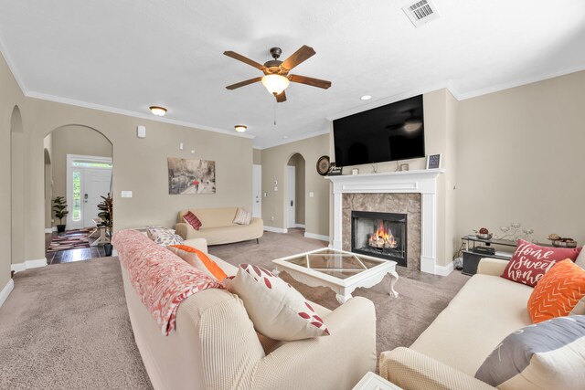 532 Bunchgrass St, Evans, GA 30809 - living room with arched walkways, light carpet, baseboards, and crown molding