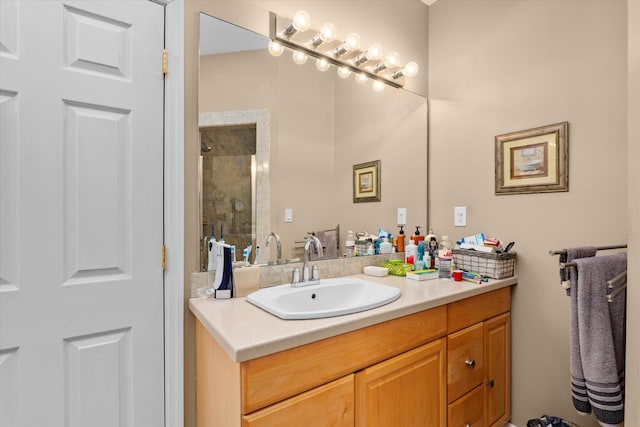 bathroom featuring a shower stall and vanity