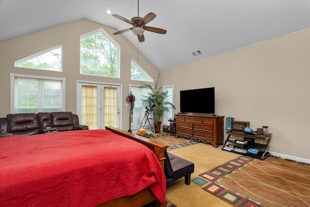 carpeted bedroom with visible vents, ceiling fan, and high vaulted ceiling