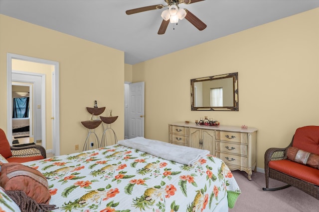 bedroom featuring a ceiling fan, baseboards, and light carpet