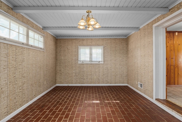 2211 Woodland Ave, Augusta, GA 30904 - unfurnished room featuring brick flooring, a chandelier, and beam ceiling