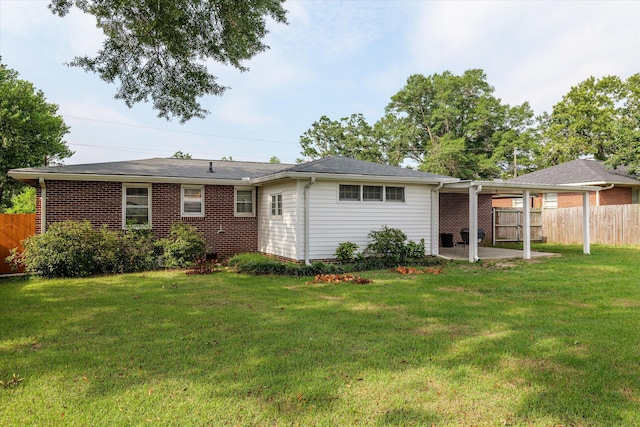 2211 Woodland Ave, Augusta, GA 30904 - rear view of house featuring a patio area and brick siding