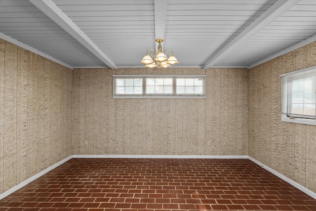 2211 Woodland Ave, Augusta, GA 30904 - unfurnished room featuring brick patterned flooring, beamed ceiling, and a chandelier