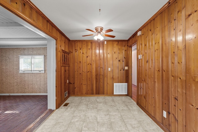 2211 Woodland Ave, Augusta, GA 30904 - spare room with a ceiling fan and wood walls