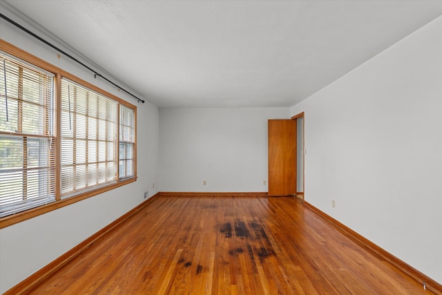 2211 Woodland Ave, Augusta, GA 30904 - spare room featuring wood-type flooring and baseboards