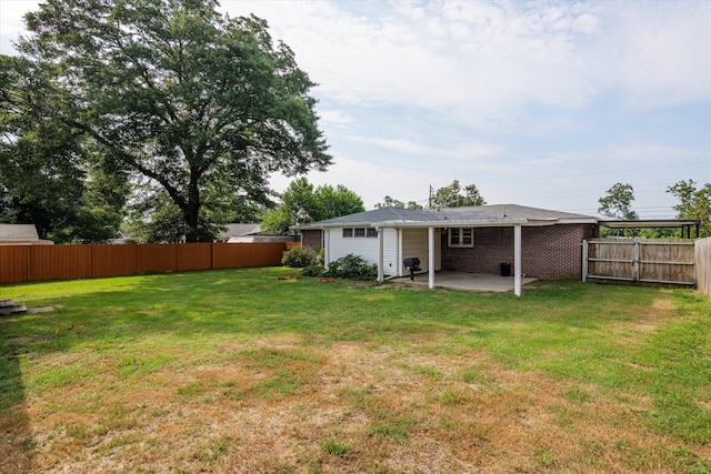 2211 Woodland Ave, Augusta, GA 30904 - fenced backyard featuring a patio area
